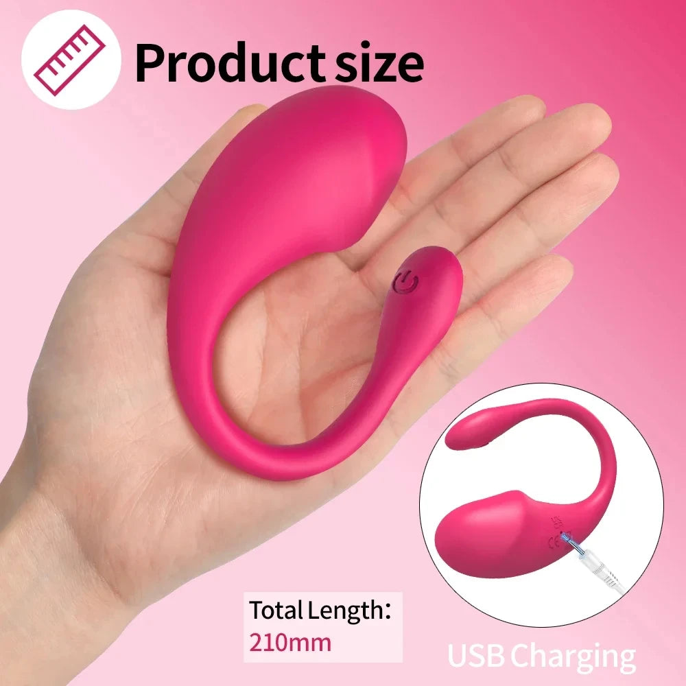 Hand holding a small pink curved USB rechargeable product with total length 210mm, on pink background