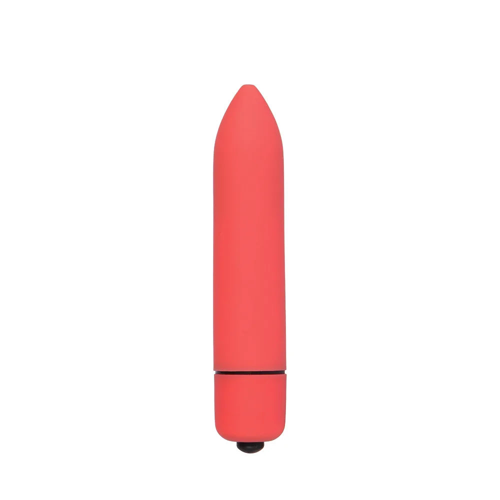 Compact red bullet vibrator with smooth silicone finish on white background