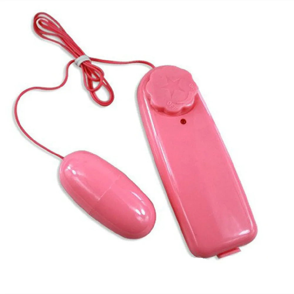 Pink wired remote control with adjustable dial and connected oval capsule-shaped device
