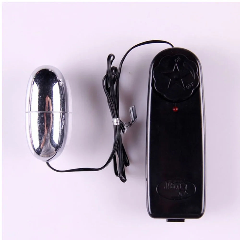 Metallic egg-shaped wired device with black remote control featuring on/off dial on white background