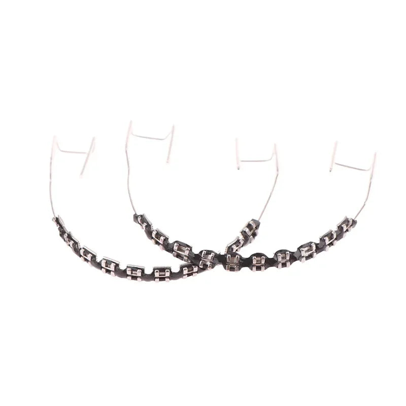 Two black and silver chain-link bracelets with rectangular metal links on white background